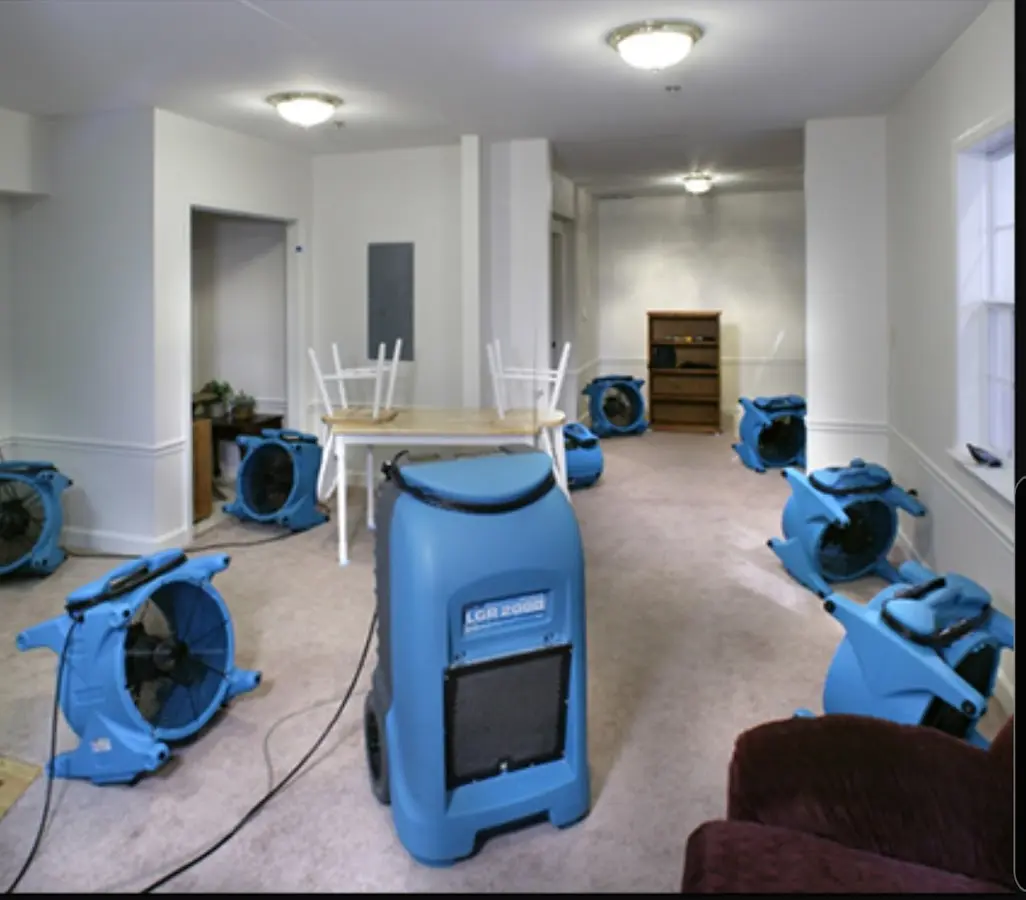 Air movers and dehumidifier setup for Water Damage Restoration in Oak Island